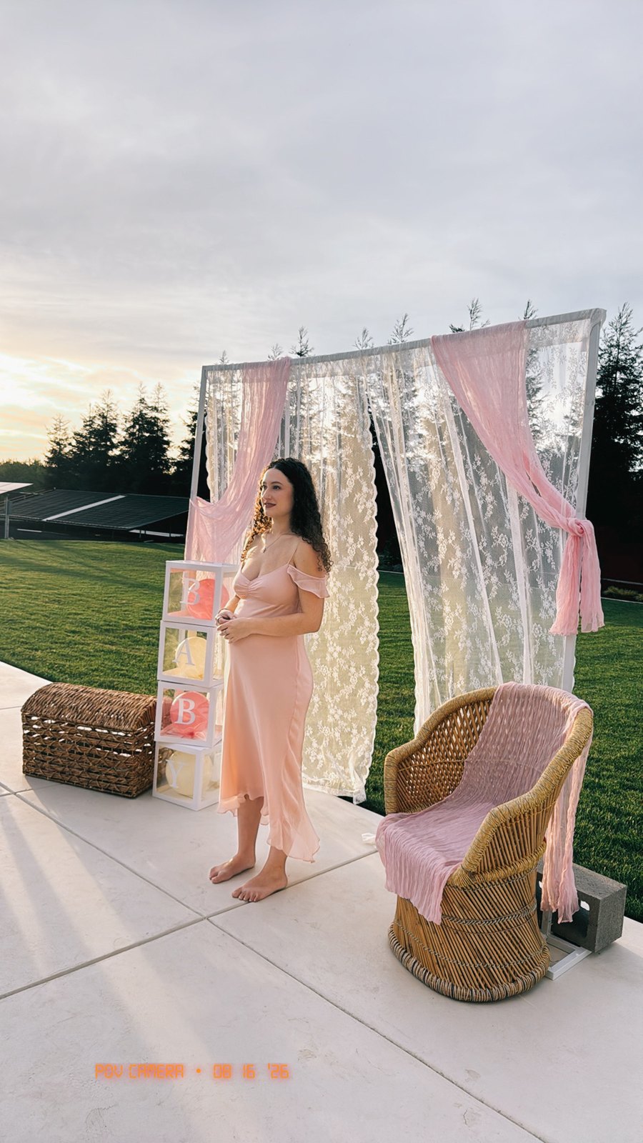 The outdoor lace and pink photo backdrop with BABY blocks at sunset
