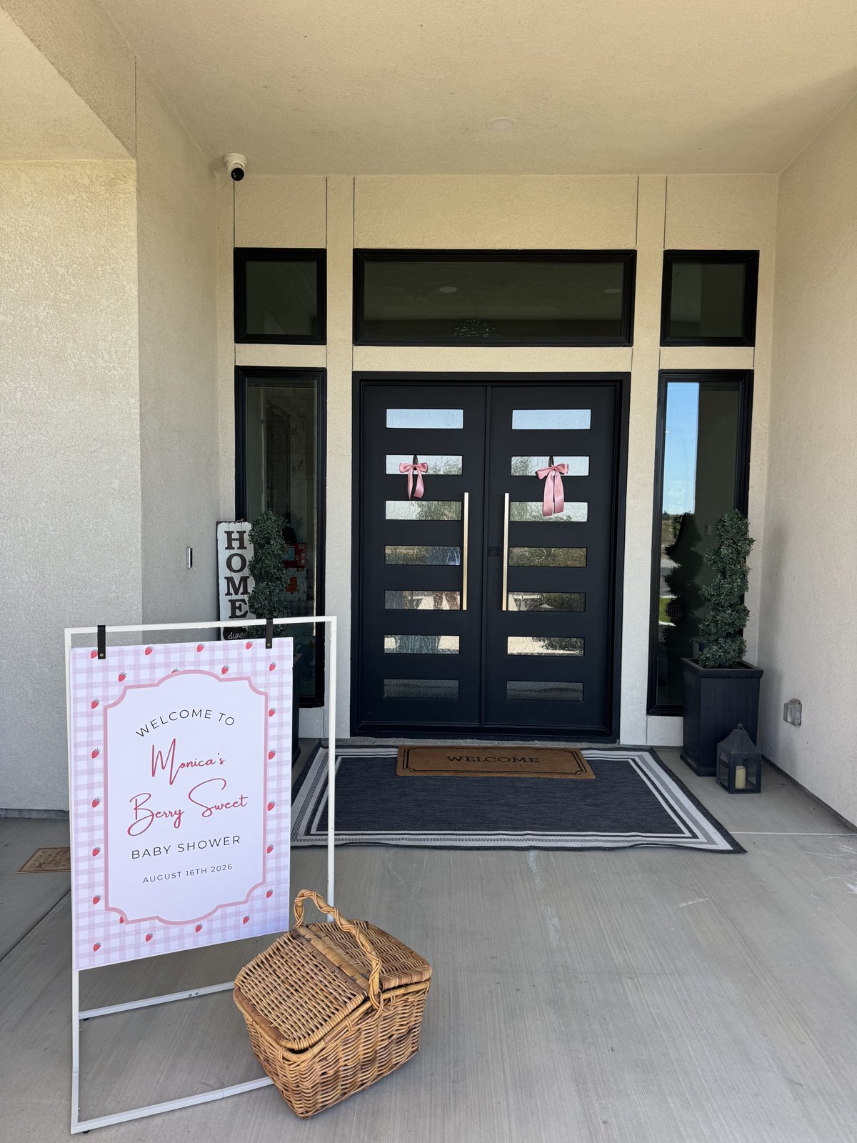 The Berry Sweet Baby Shower welcome sign and picnic basket at the front door
