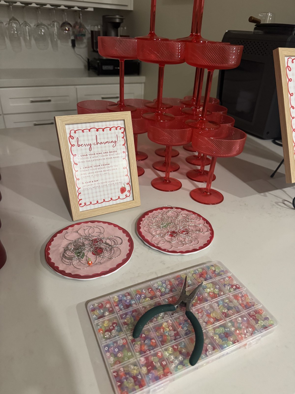Berry charming wine charm station with red glasses, beads and instructions