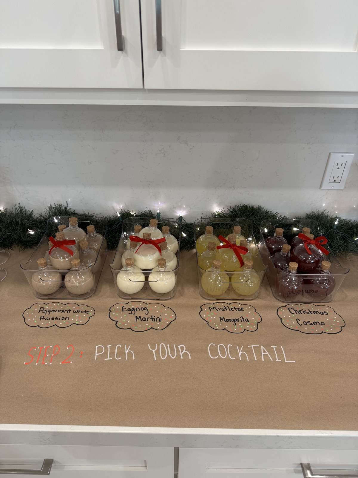 Step two — cocktail options bottled and labelled by name