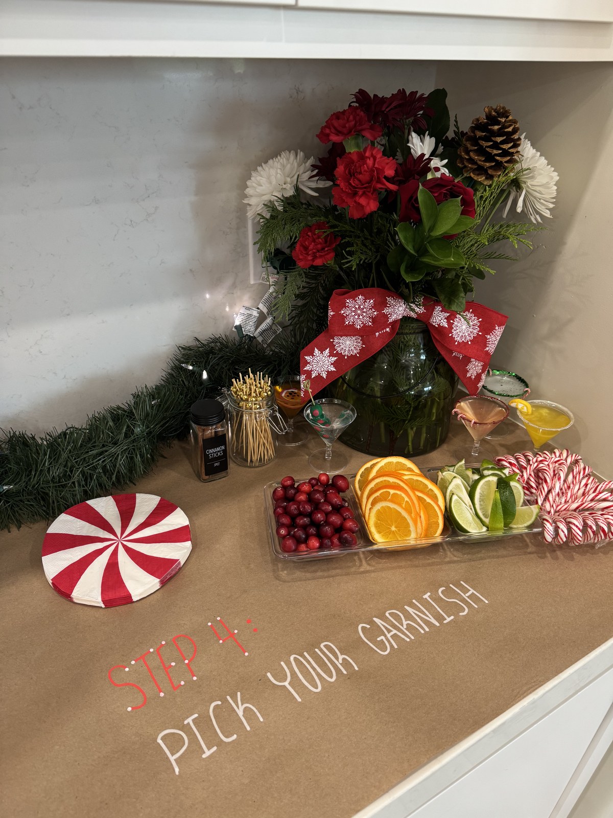 Step four — garnish station with cranberries, citrus and candy canes